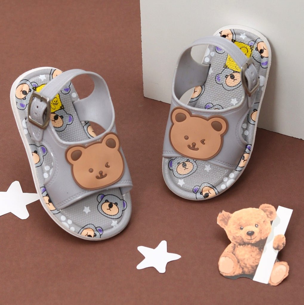 Cute grey sandals with bear applique and cartoon bear print for toddlers.