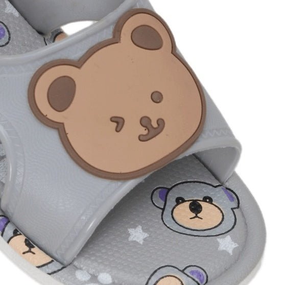 Close-up of the bear applique on grey toddler sandals with cartoon bear print