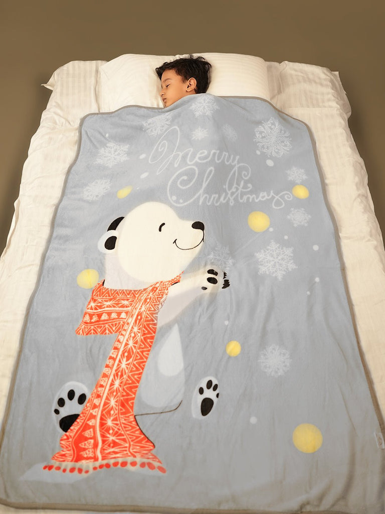 Sleeping child covered with a polar bear blanket - Sweet Dreams of Arctic Adventures