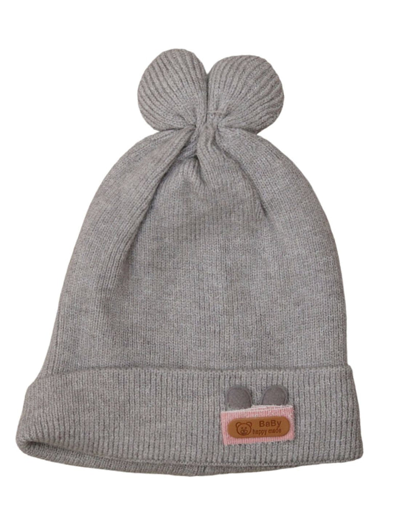 Front view of grey woolen cap with pom-pom and folded brim