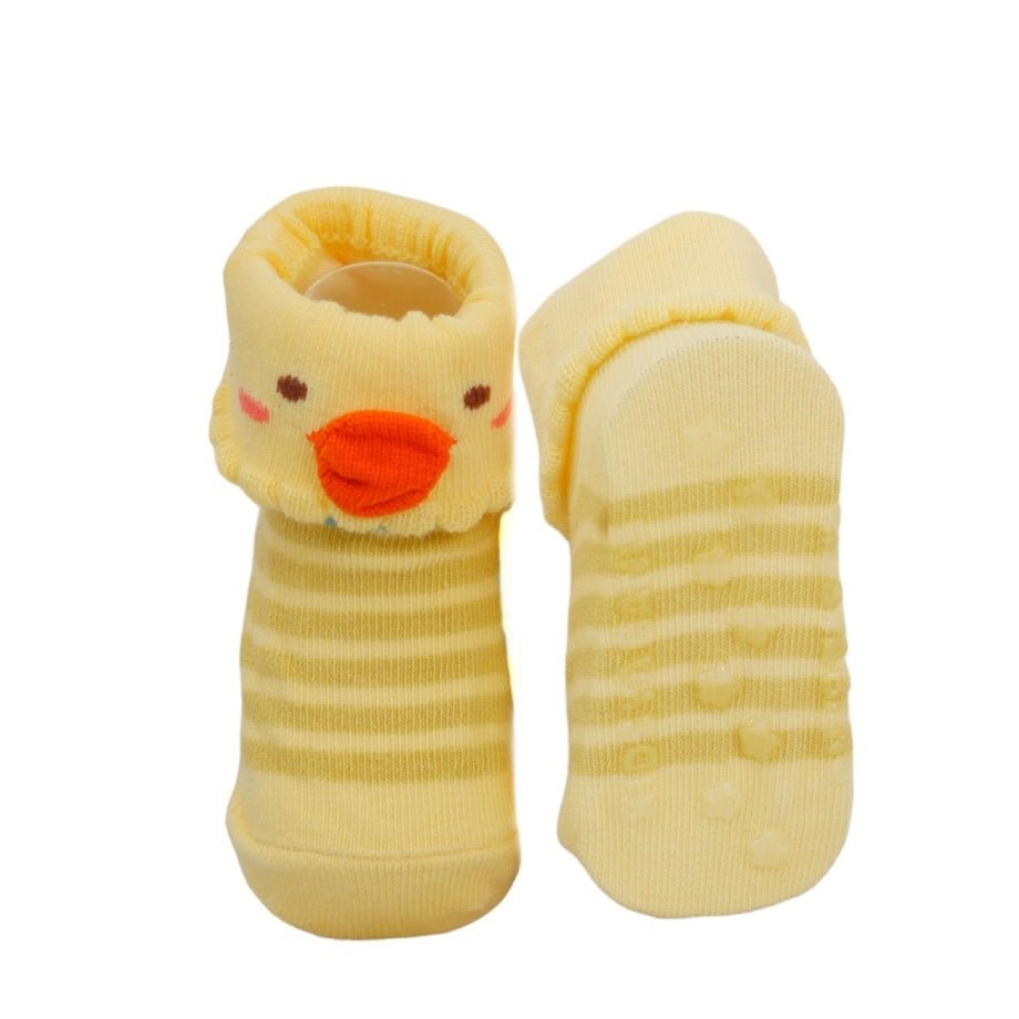 Bottom view of yellow duck baby socks with anti-slip soles for safe walking.