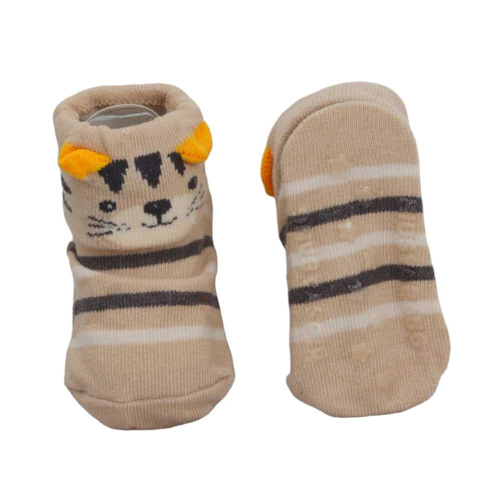 Bottom view of tan striped anti-skid baby socks with tiger face design.