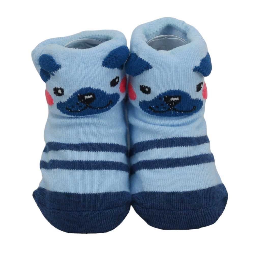 Close-up of blue animal-themed baby socks with bear design and anti-skid bottom
