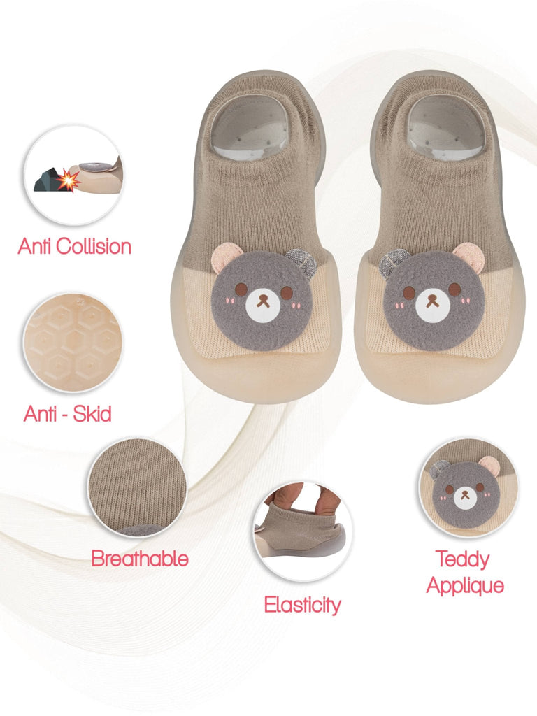 Full view of Yellow Bee's beige teddy shoe socks with safety and comfort features