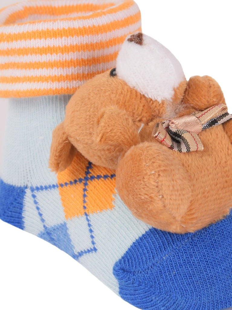 Close-up view of the Bear Stuffed Toy Socks' plush bear detail and striped pattern.