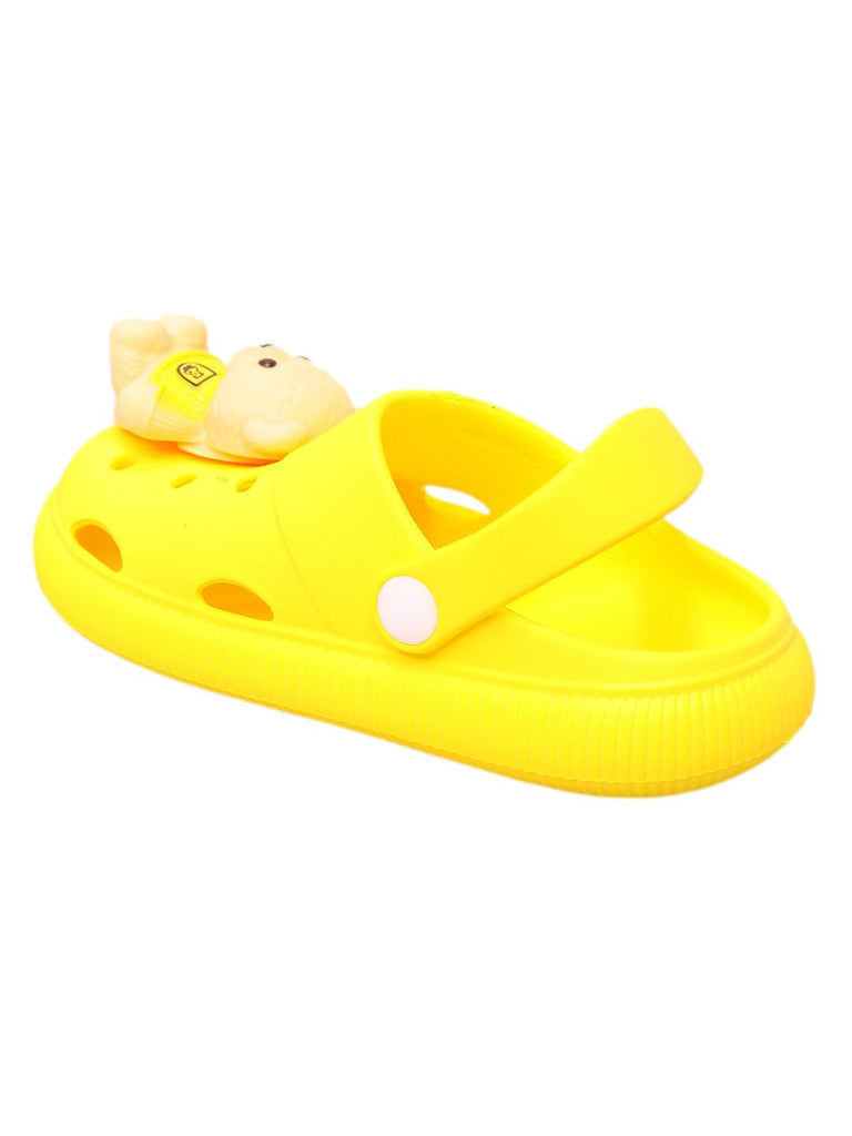 Top view of yellow clogs showcasing the teddy bear applique and breathable holes for comfortable wear.