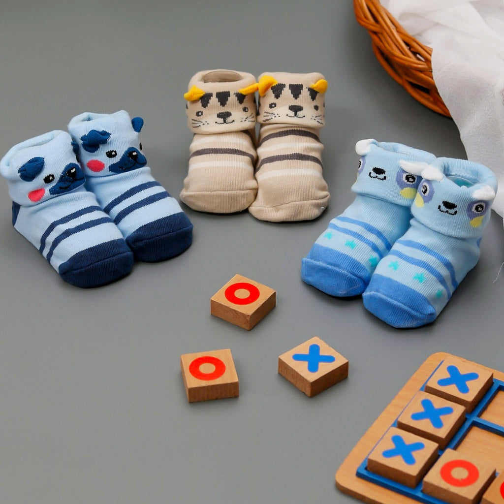 Baby girl animal-themed anti-skid sock set on a playful background.