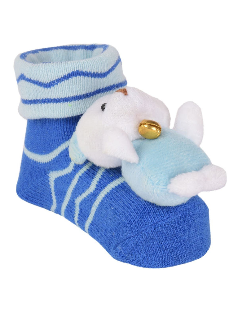 Plush Polar Bear Toy on Toddler Socks Close-Up