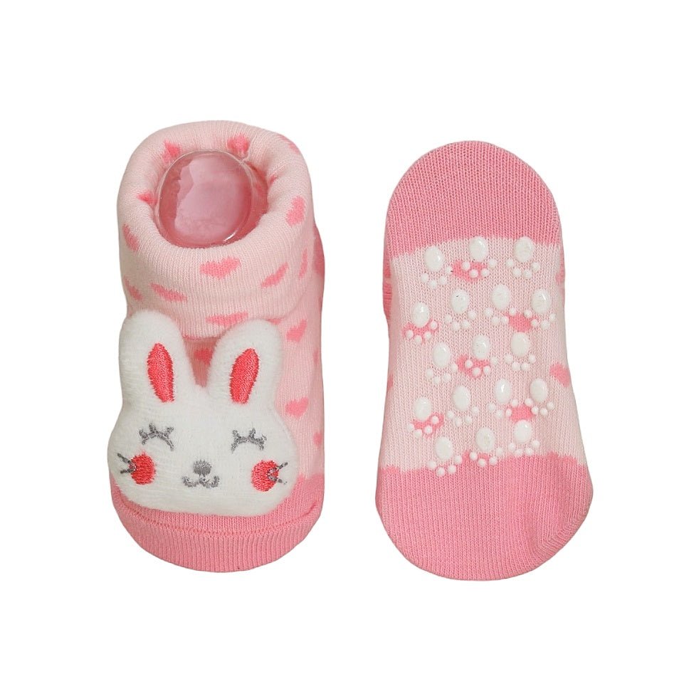 Side view of Yellow Bee's bunny toy socks, showing the detailed design and anti-skid dots on the sole