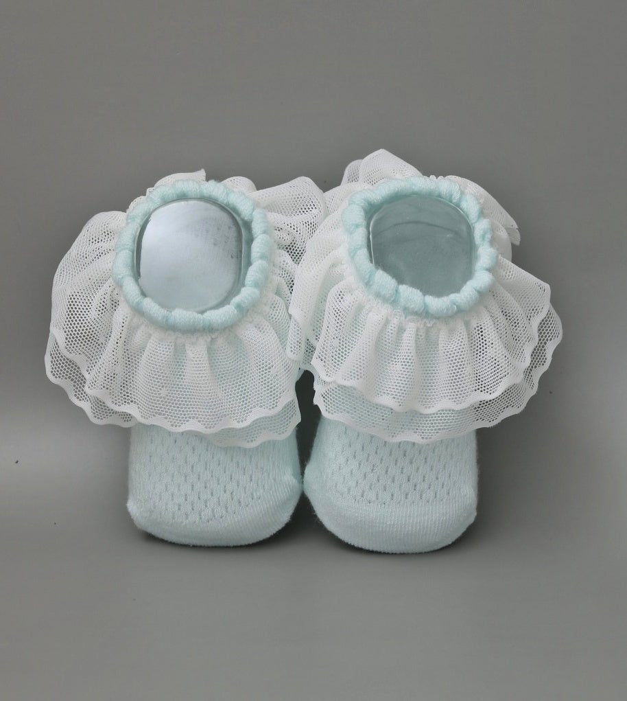Soft blue leather socks with white lace frill for baby girls - top view