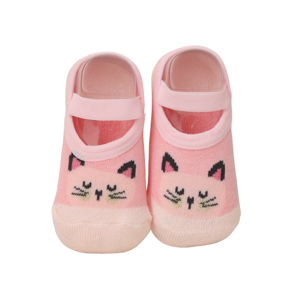 Close-up image of pink kitty print cotton-leather baby socks by Yellow Bee.