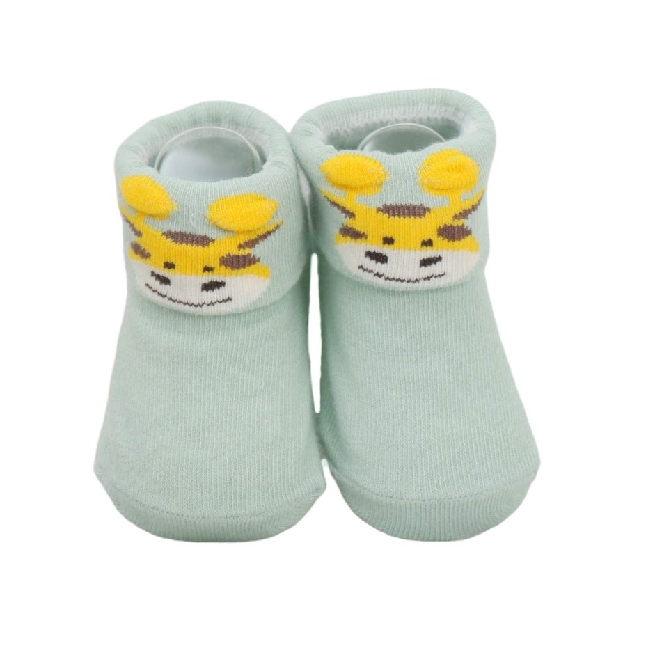 Light blue infant socks with giraffe print design, top view.