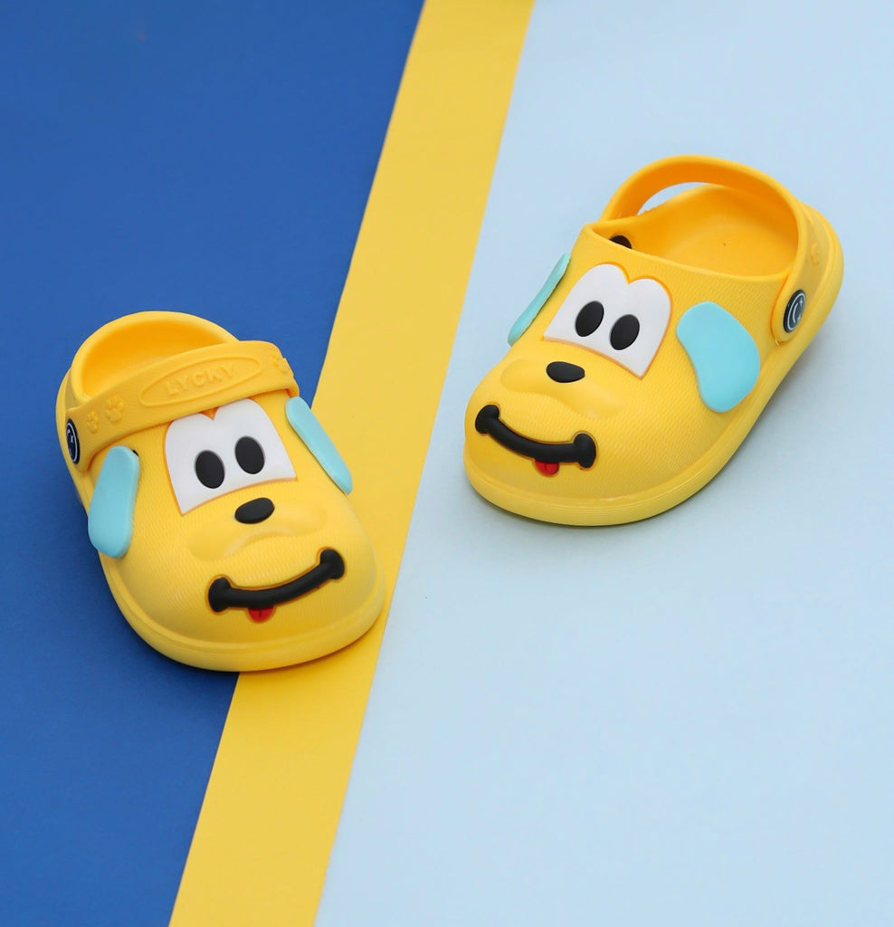 Yellow puppy pattern clogs for boys on a blue and yellow background.