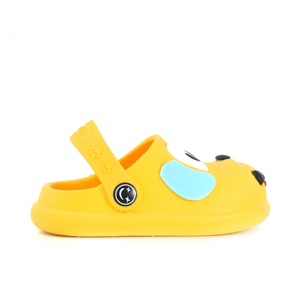 Yellow puppy pattern clogs for boys by Yellow Bee, overhead view.