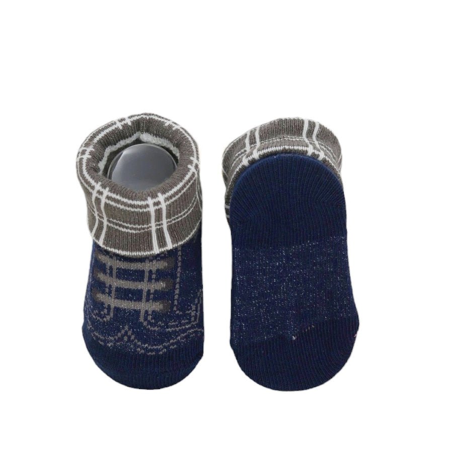 Bottom view of navy blue baby socks with non-slip details from Yellow Bee.
