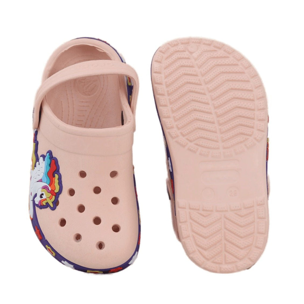 Overhead and sole view of peach-colored kids' clogs with unicorn detailing, illustrating the anti-slip tread