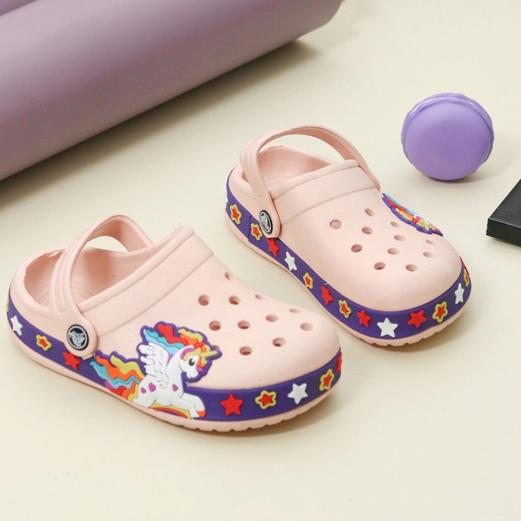Peach-colored kids' clogs adorned with a unicorn and star pattern, perfect for imaginative play