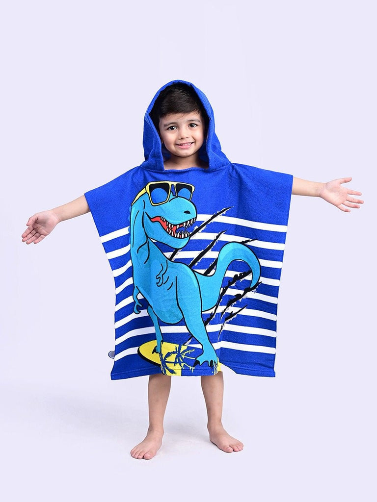 Joyful boy wearing the Yellow Bee Dino Hooded Poncho Towel in vibrant blue color.