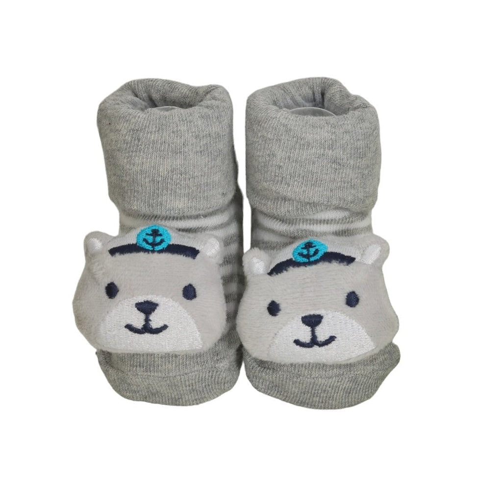 Grey baby socks with teddy bear design and captain's wheel, equipped with anti-slip soles by Yellow Bee.