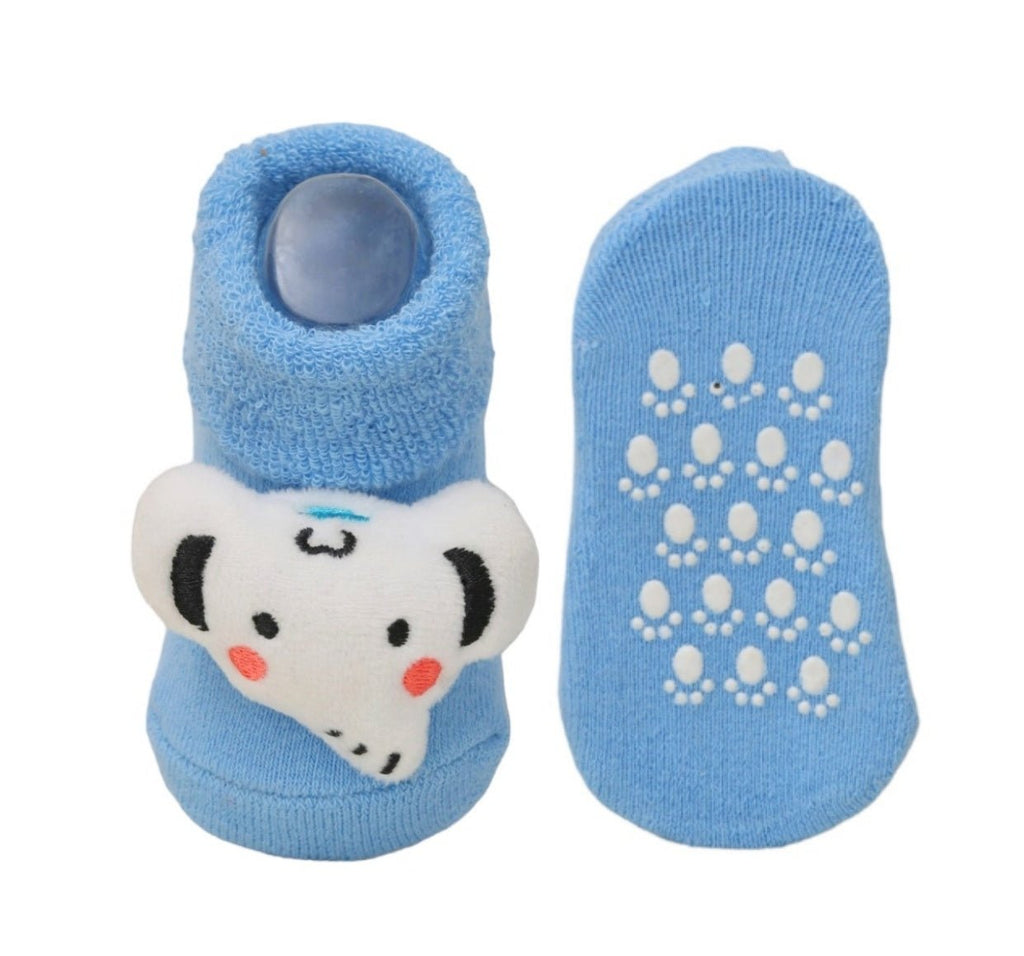 Blue sock with elephant design and non-slip sole for kids, front and bottom view.