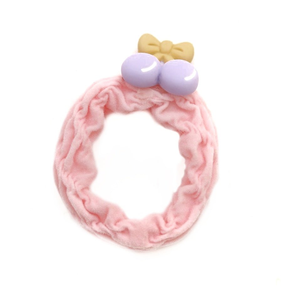 Pink rubber band featuring a cherry, part of the Yellow Bee girls' collection.