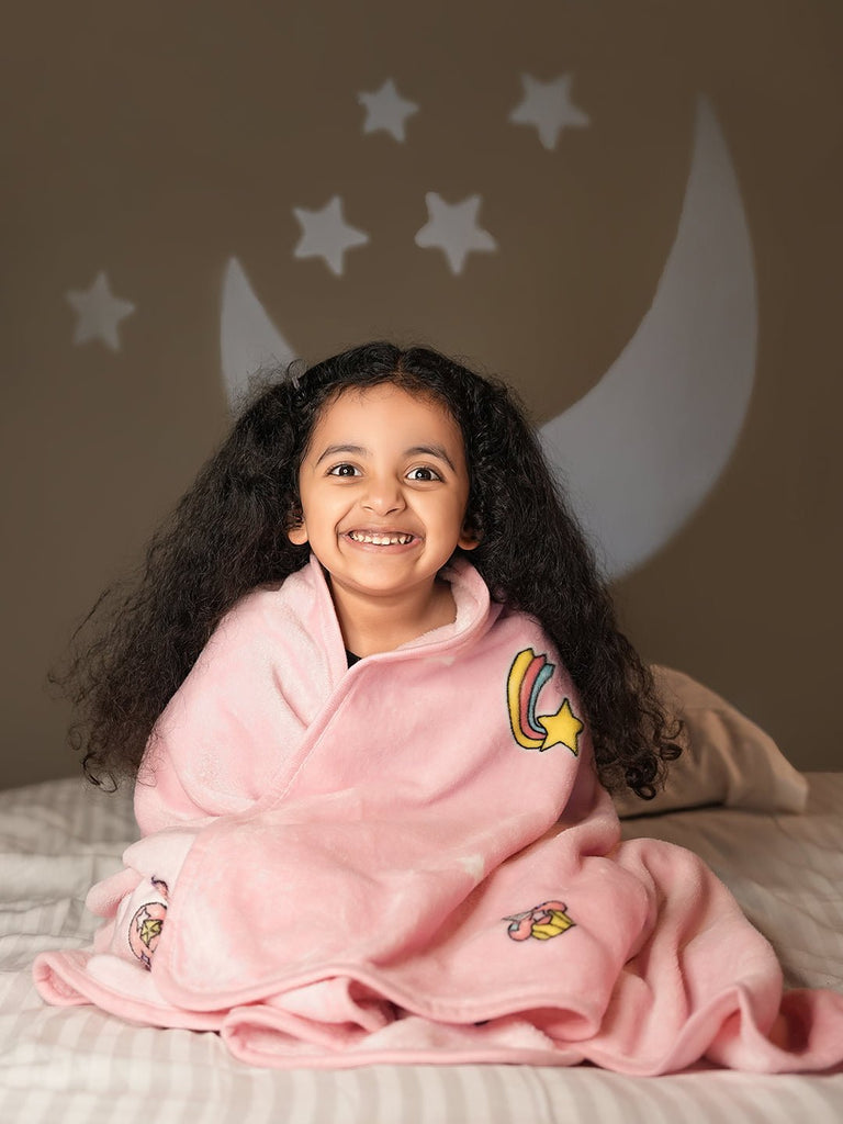 Happy Girl Snuggled in Pink Unicorn Blanket - Cozy and Magical