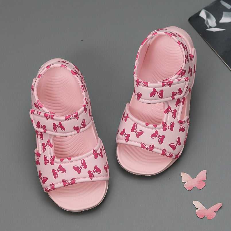 Child's pink sandals with bow patterns