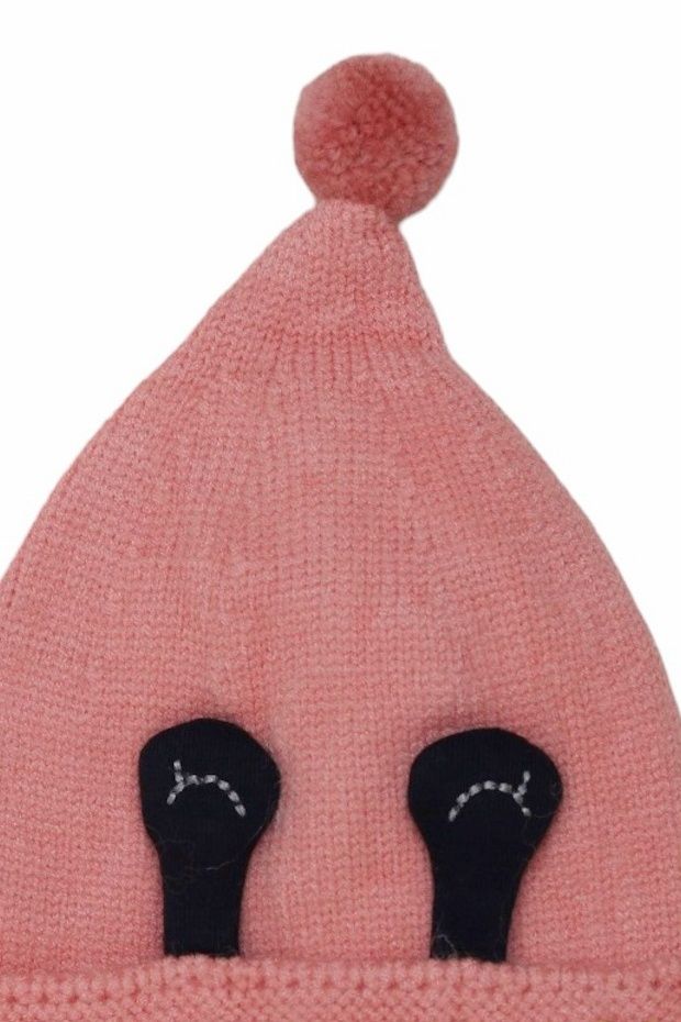 Adorable and warm knit pink beanie for girls with a fun eye design and top pom-pom.