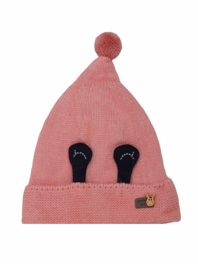 Front view of the pink beanie hat featuring cute eye applique and a pom-pom for toddler girls