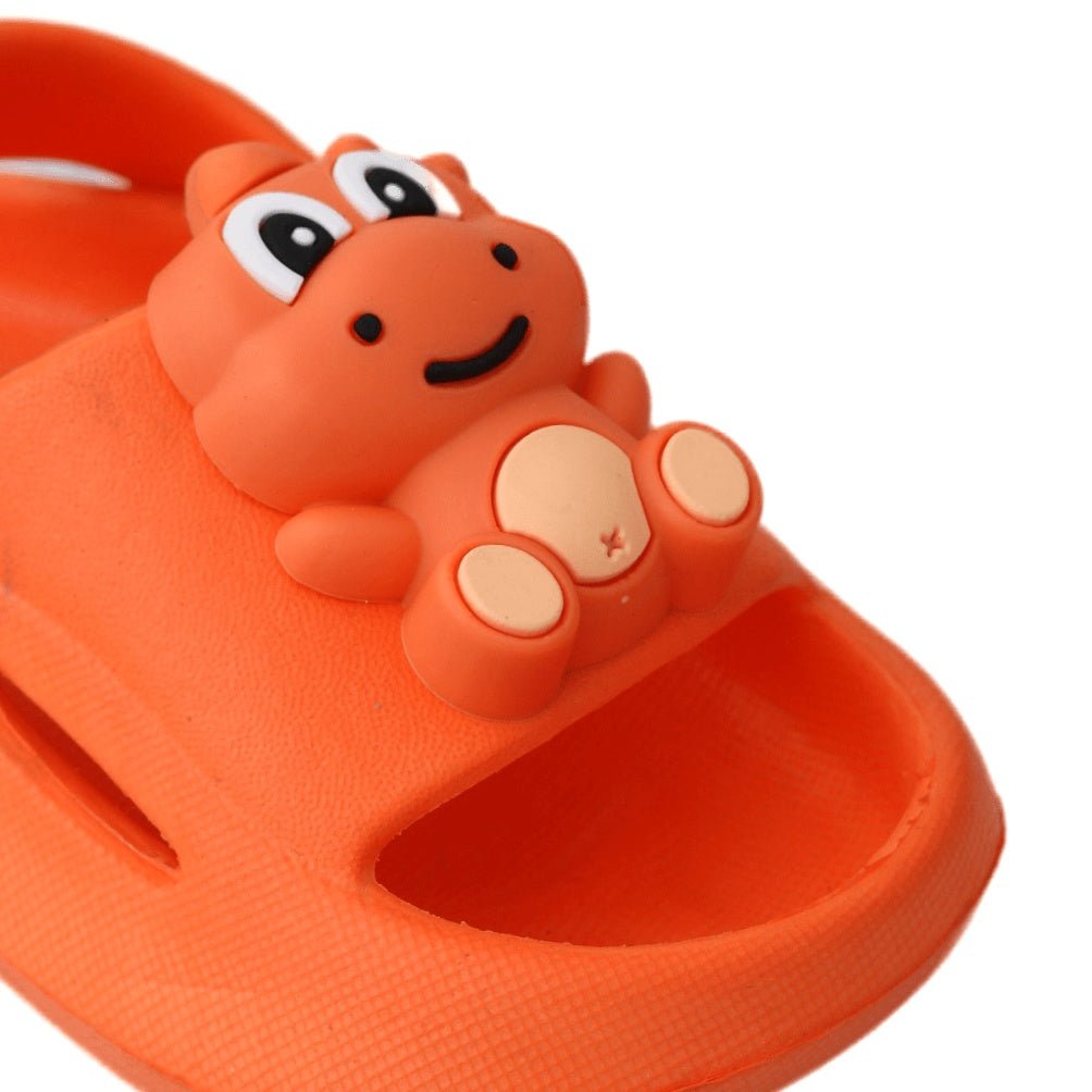 Close-up of the cute dino face on an orange sandal for kids.