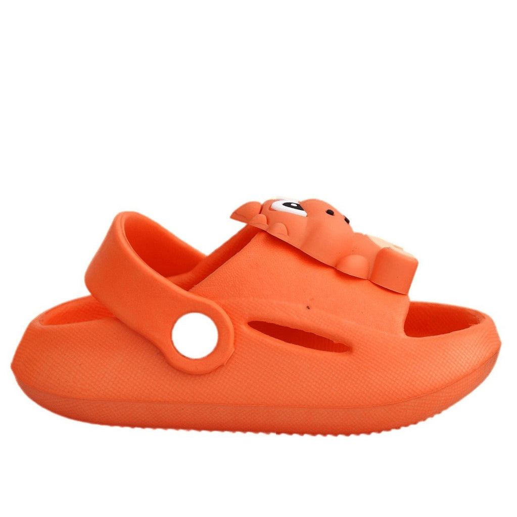 Side view of a kid's orange dino sandal with adjustable strap.