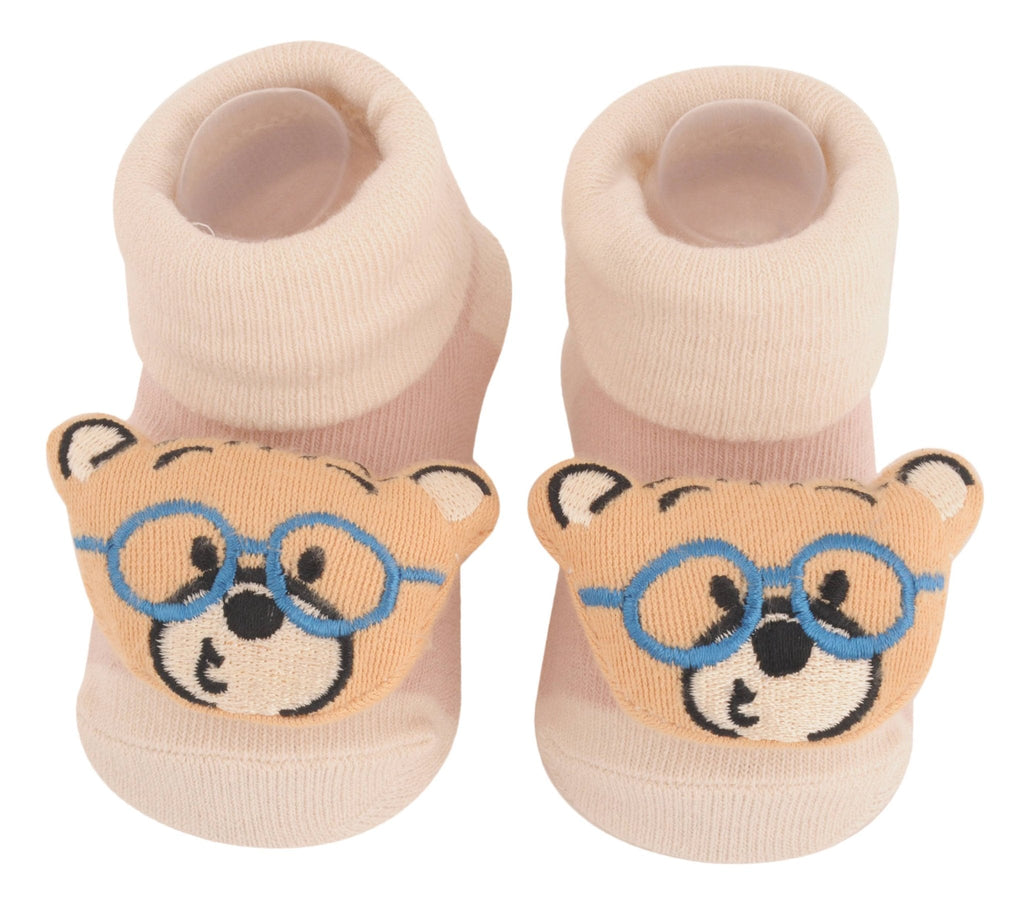 Pair of beige teddy bear socks with blue glasses design for children