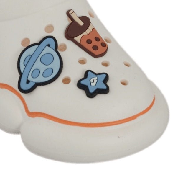 Close-Up of Space Motif on Children's Clogs with Planets and Stars Design