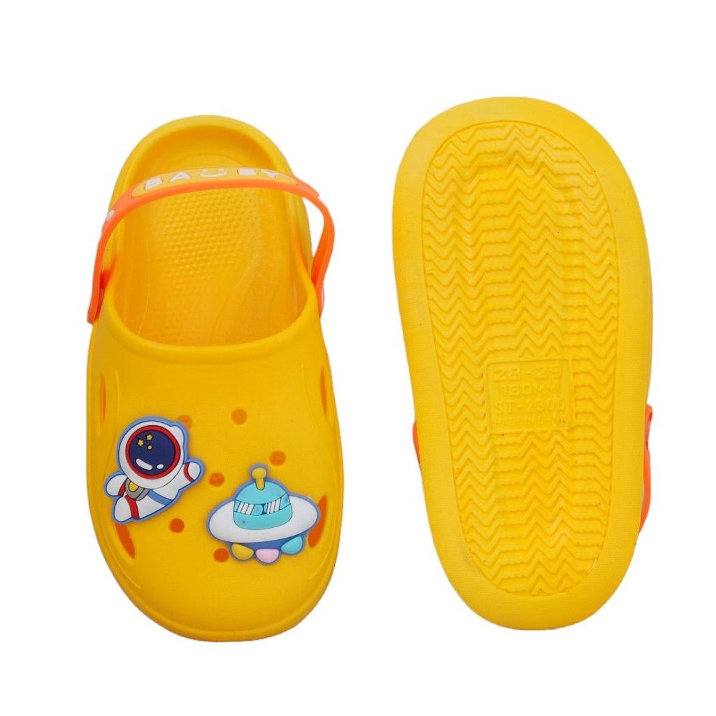 Bottom view of yellow space motif clogs showing anti-slip tread