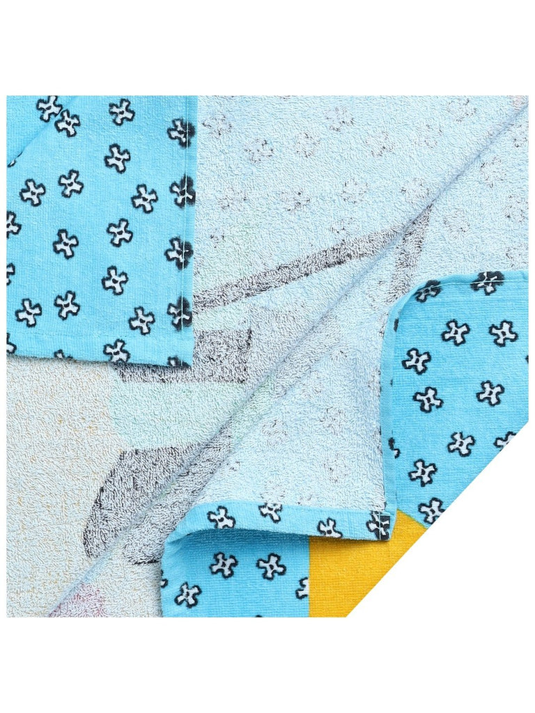 Texture detail of Yellow Bee's soft cotton hooded poncho towel for kids