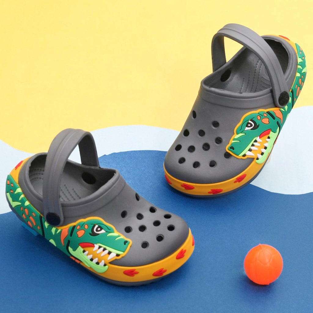 Kid's Grey Dinosaur Clogs with a Vibrant Dino Design on a Colorful Background