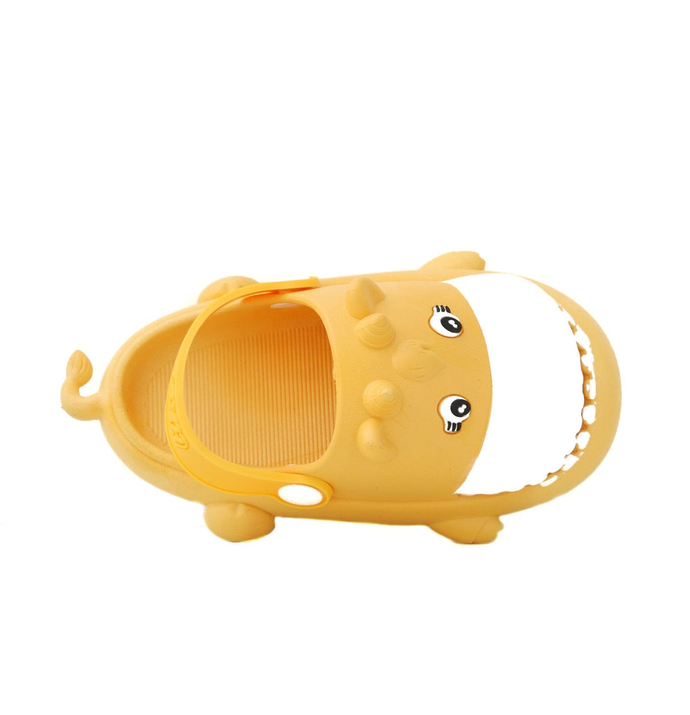 Lateral side of the yellow hippo toddler clog with a focus on the playful face and strap