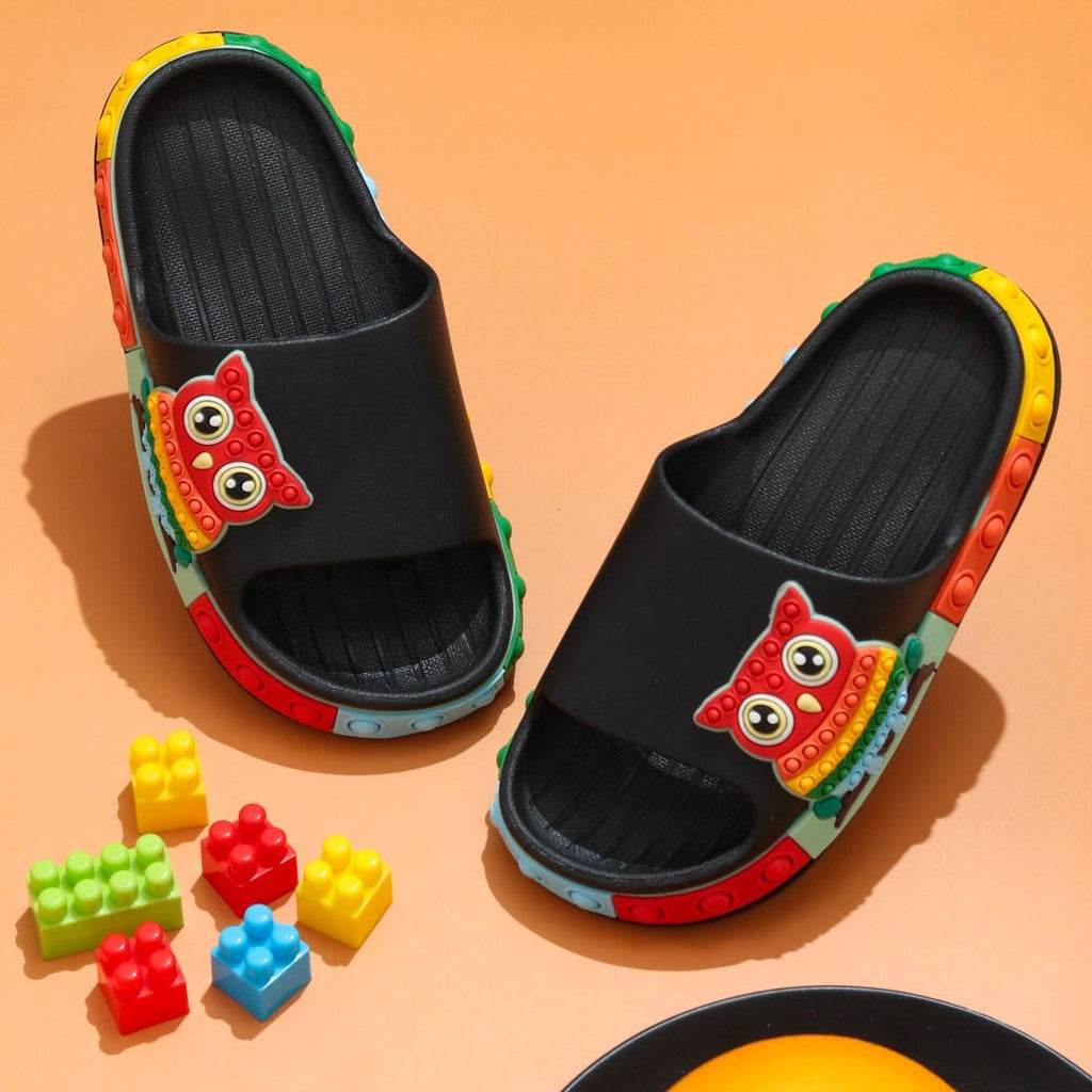 Top View of Kids' Black Pop-It Owl Slides with Colorful Accents