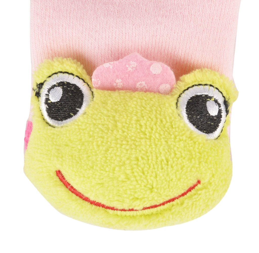 Close-up of the cute frog face stuffed toy on pink children's socks.