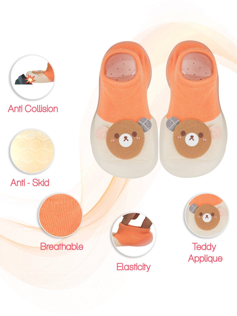 Top view of Yellow Bee's orange teddy shoe socks with essential safety features
