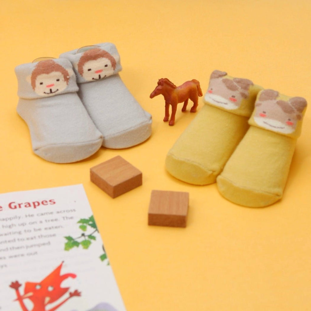 Playful set of monkey and giraffe socks for baby boys with a soft, snug fit