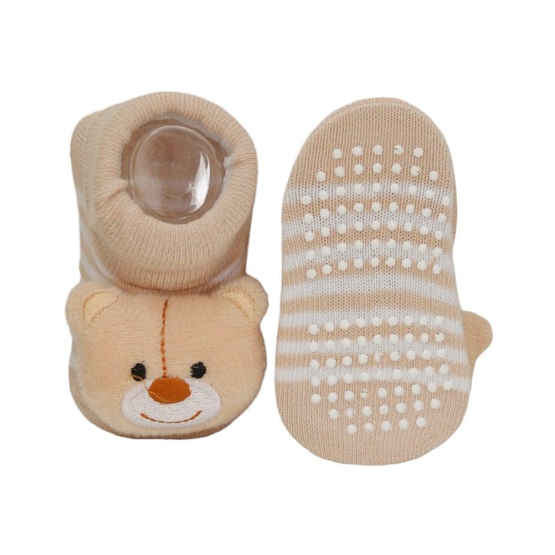 Close-up of Yellow Bee's non-slip soles on plush bear-themed socks for toddlers