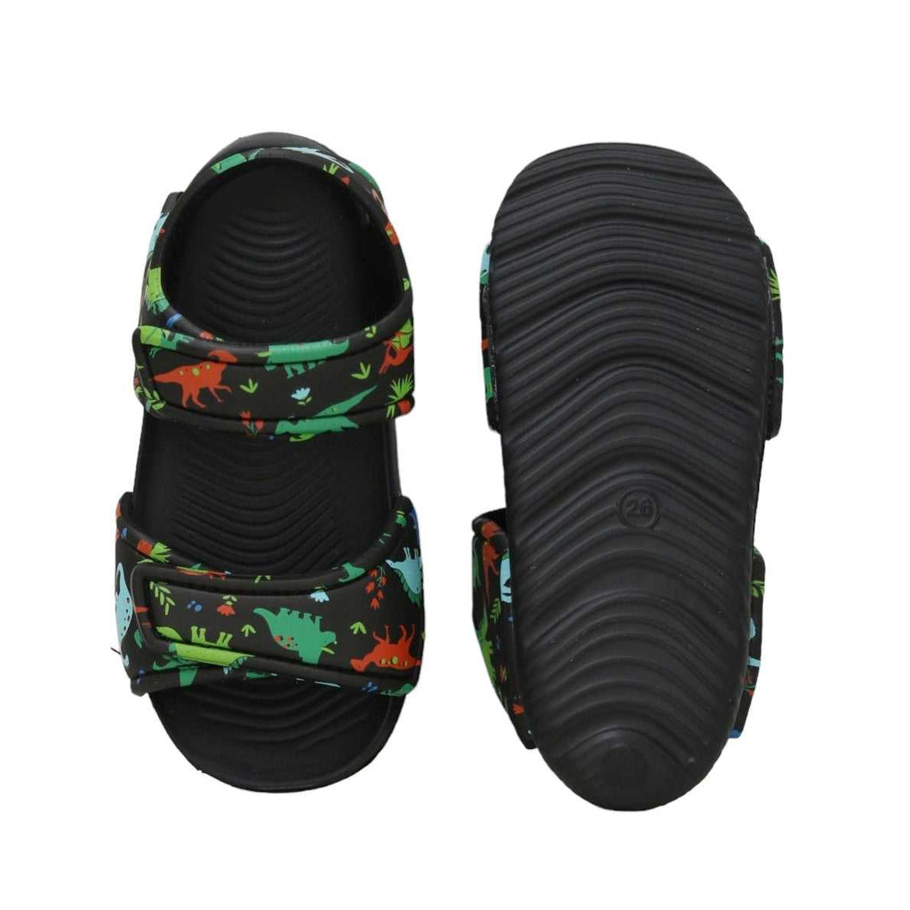 Top and sole view of kids' black sandals featuring an exciting dinosaur print, ready for play.