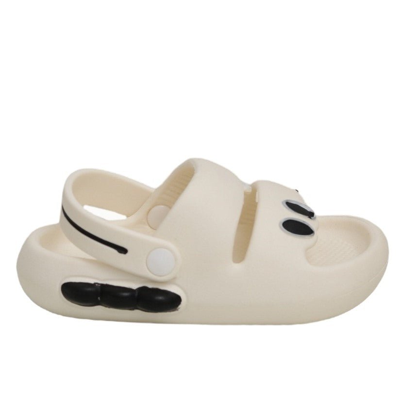 White dino sandal lying flat, highlighting the comfy design and cute dino features.