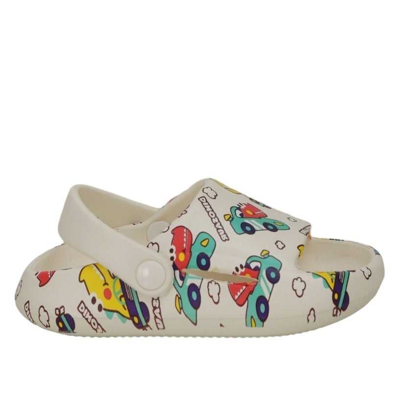 Side view of white sandals with a fun and bright dinosaur-driving-cars pattern for kids.