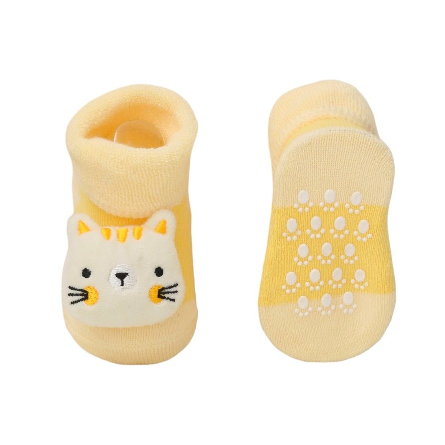 Image of the anti-slip sole on Yellow Bee's yellow kitty stuffed toy socks, providing grip for babies' first steps.