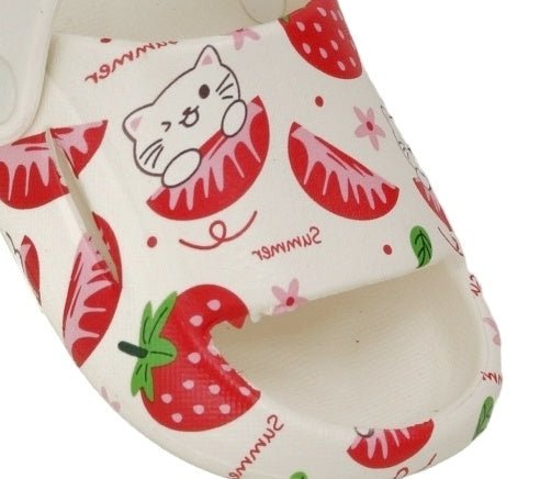 Close-up of the white sandals' upper part with strawberry and cat print