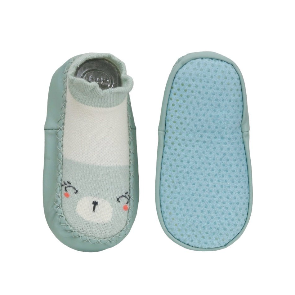 Top and sole view of mint green baby girl socks with anti-slip dots and cute kitty design.