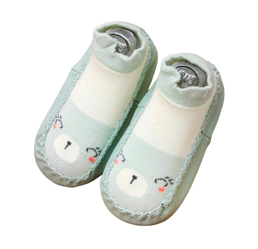 Top view of mint green leather socks with a cute kitty print for baby girls (12-18 Months).