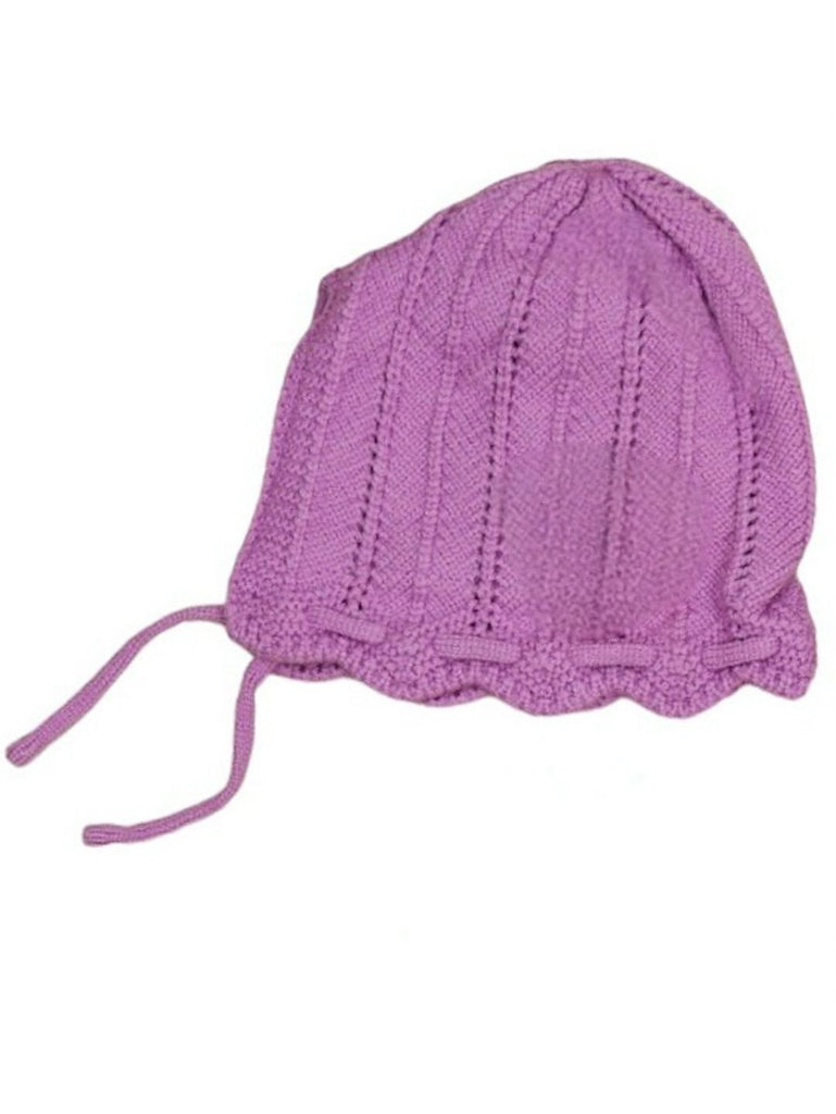 Angled view showing the knit pattern and flower detail of the purple beanie for girls.